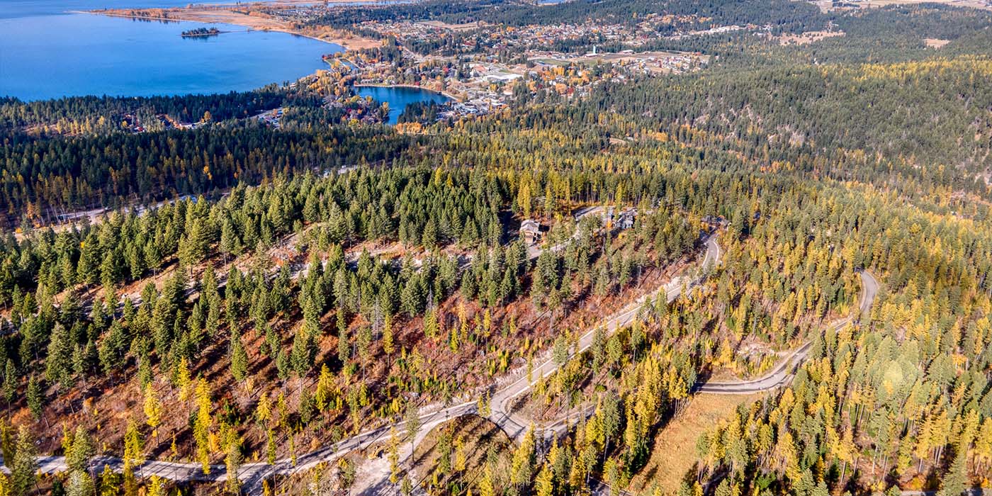 Aerial view of Saddlehorn property with Flathead Lake in the distance